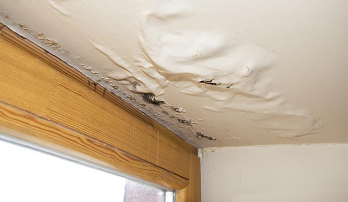 Water damaged ceiling due to roof leak